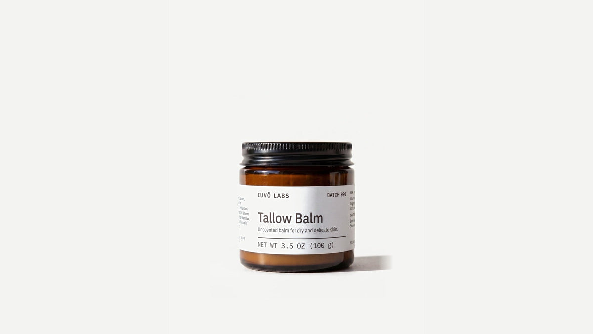Tallow Balm in an amber glass jar with a black lid