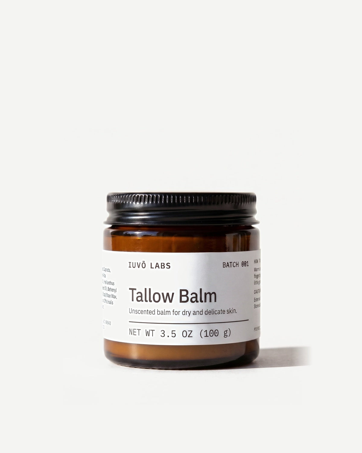 Tallow Balm in an amber glass jar with a black lid