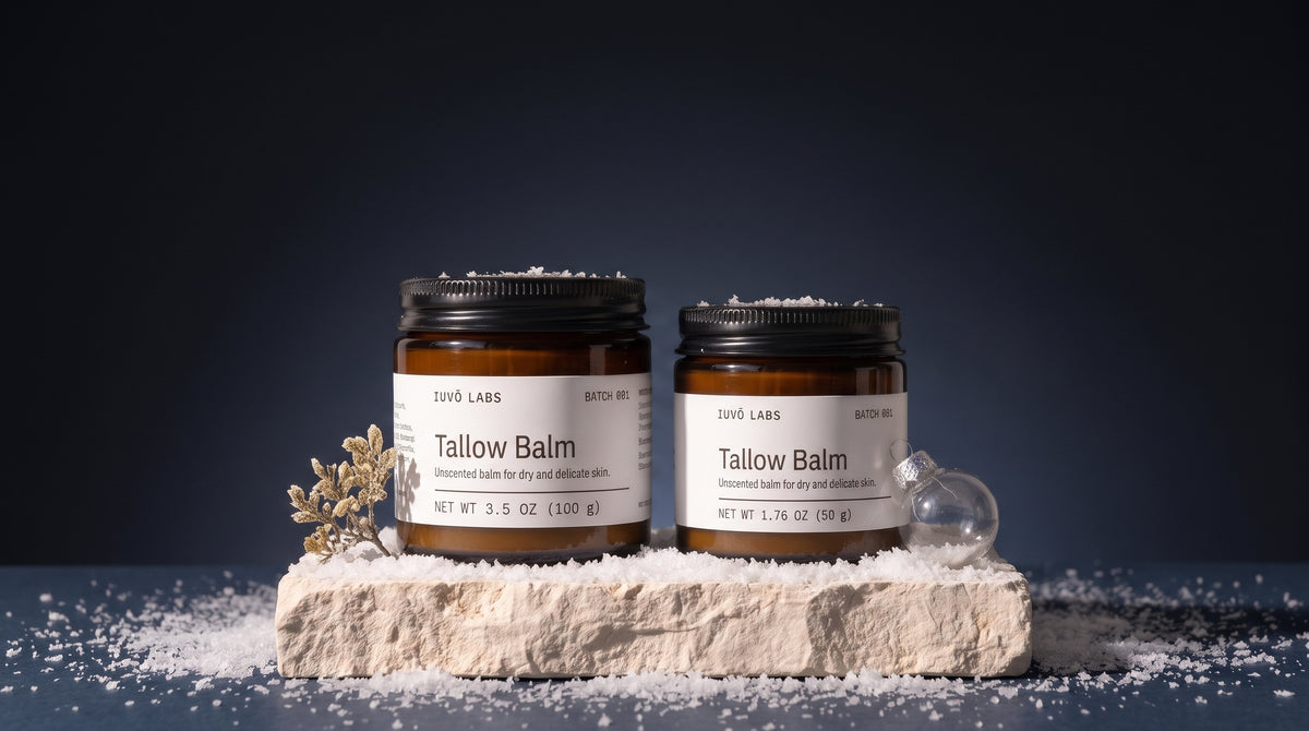 Tallow Balm in 100 g and 50 g on a limestone block against a dark winter backdrop
